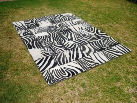 Zebra cowhide rug